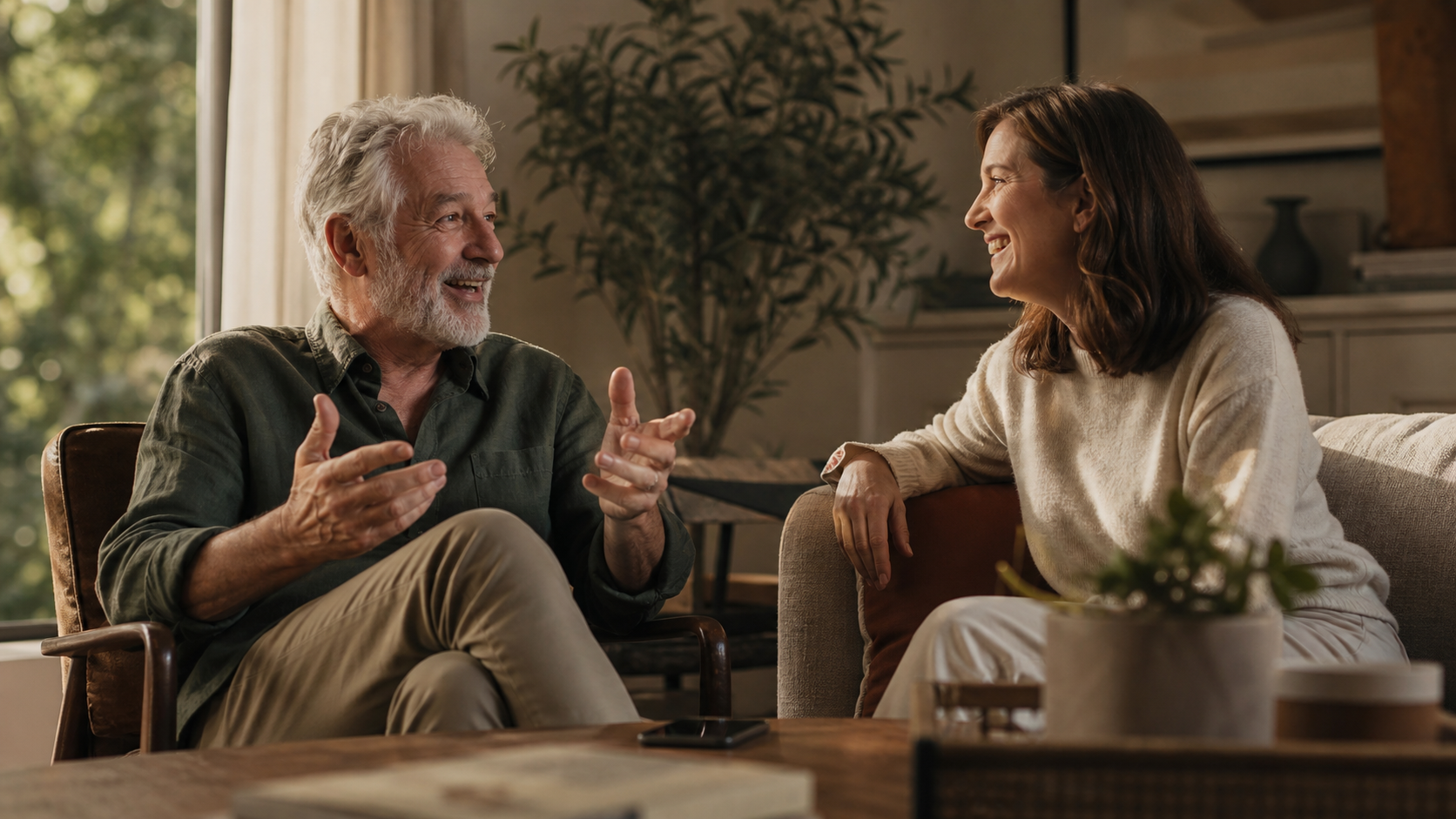 A father and adult daughter sharing a warm conversation at home